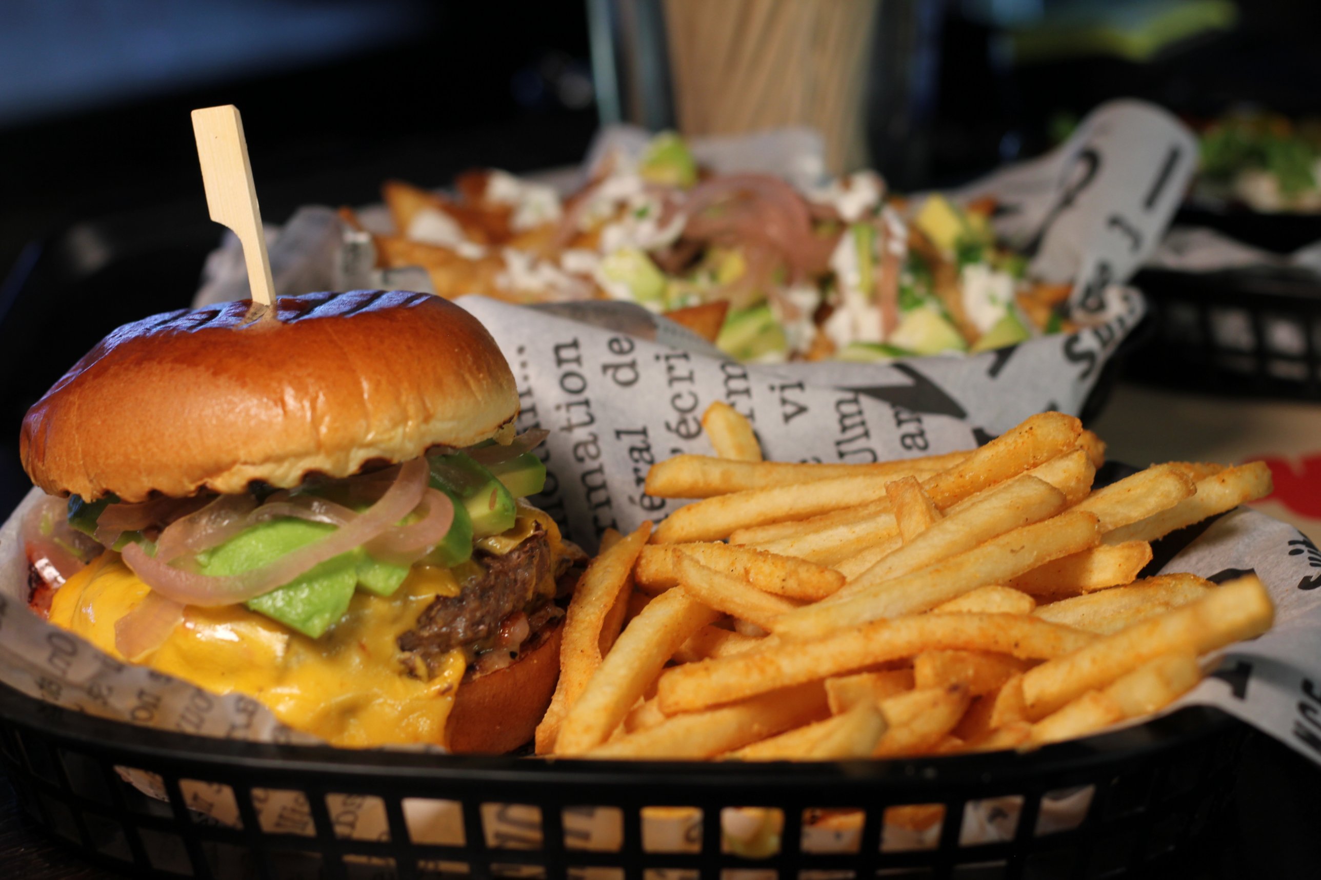 Paradise Burger — avocado, cheddar, pickled onion, fries