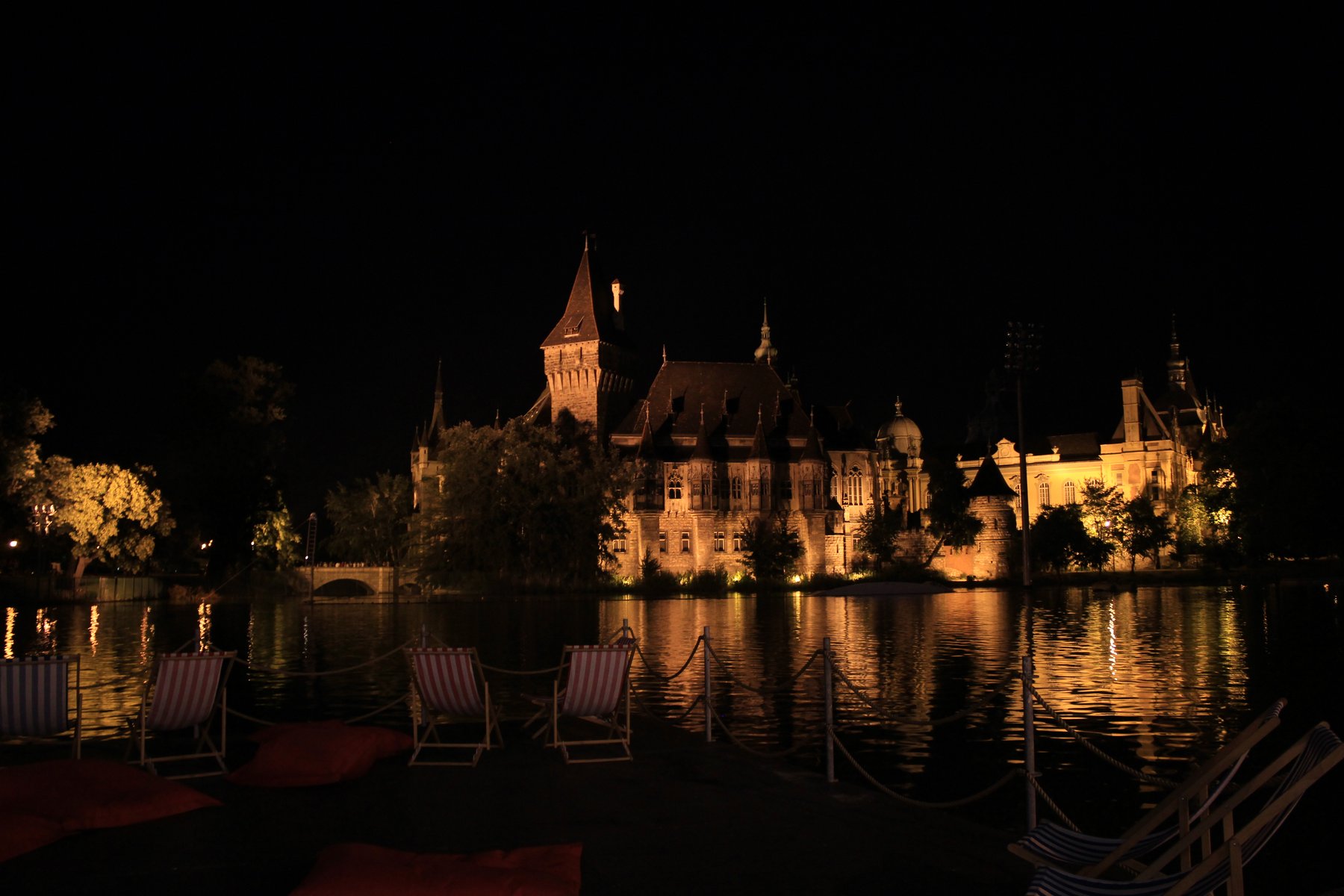 Vajdahunyad Castle, Budapest at night with lake reflection